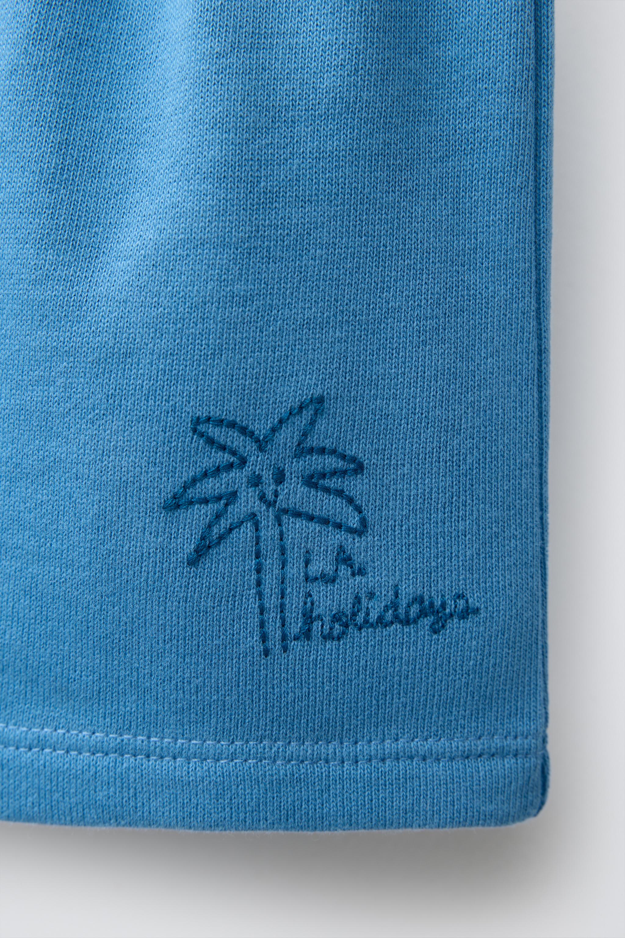 EMBROIDERED PALM TREE SHORTS